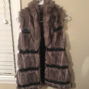 Faux fur vest with leather detail
